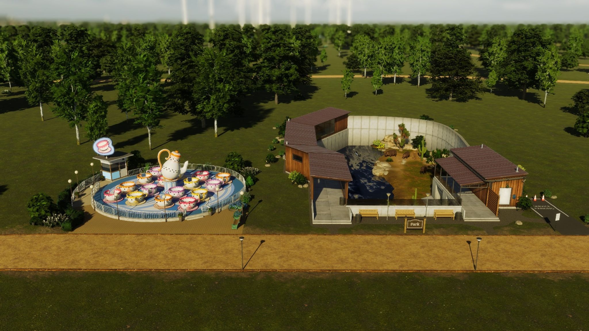 Spinning tea cups and hippo enclosure